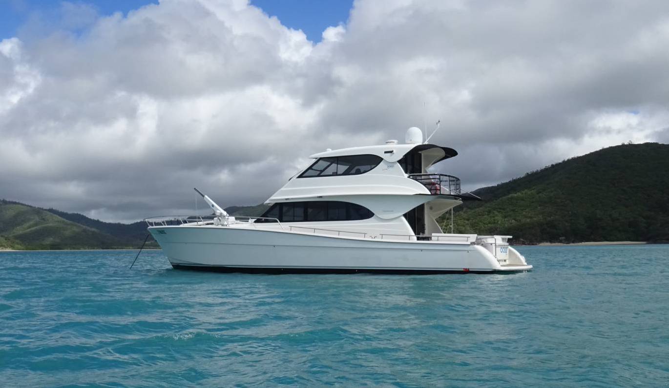 Maritimo 60 foot motor cruiser at anchor during a yacht delivery to avoid heavy weather. 