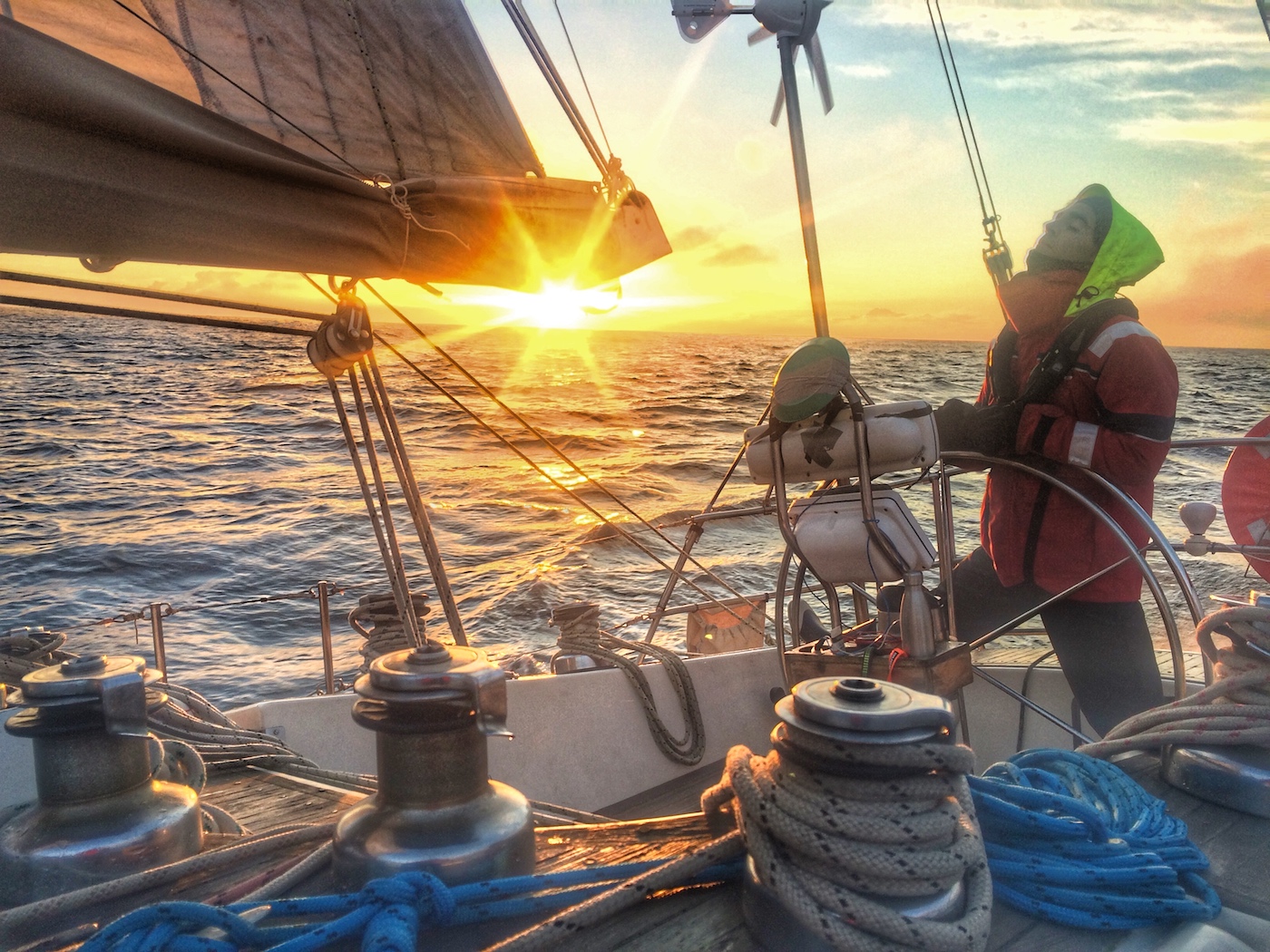 Yacht delivery skipper onboard a 40 foot yacht in the morning sun in Bass Straight, Australia. 