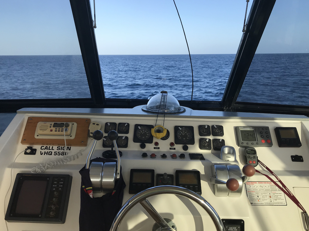 View from the helm of a 60 foot motor cruiser during yacht delivery from Mackay to the Gold Coast, QLD, Australia. 